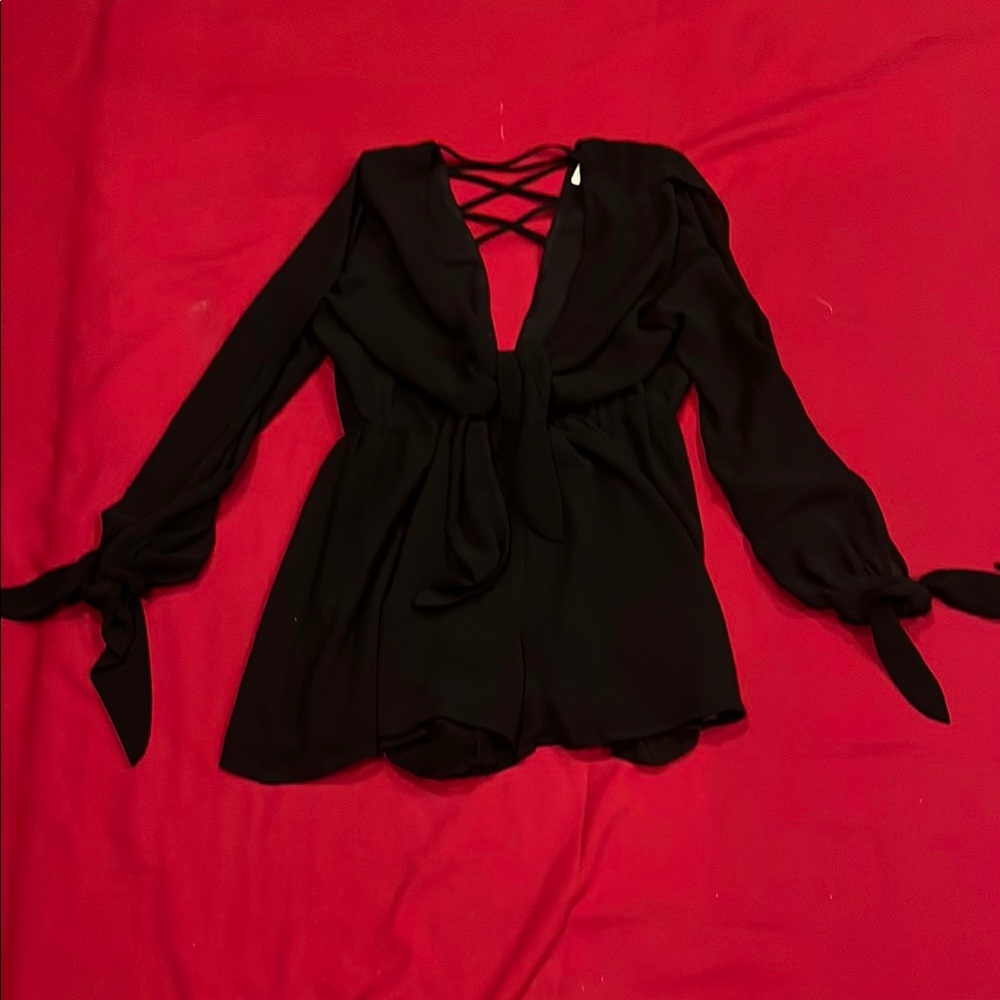 Mustard Seed Black Ruffled Tie Front short jumpsuit.